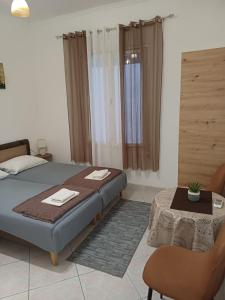a bedroom with a bed and a table in it at Studio Rada in Ulcinj