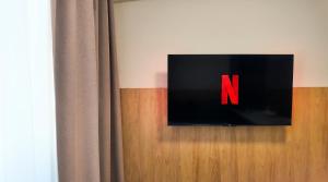 a sign with the letter n on a door at Axiom Suites - Nova 4 in KoÅ¡ickÃ© KÃºpele