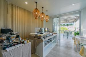 a kitchen with a counter with food on it at Little Home Ao Nang in Ao Nang Beach