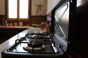 a stove top oven in a kitchen at Welcomehome in Chefchaouen