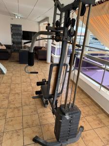 a room with a gym with a treadmill at Noble Villa in Abidjan