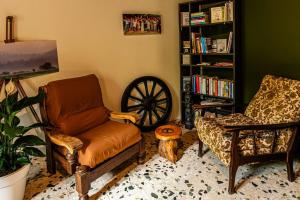 a living room with a couch and a chair at Les Portes Neuves! in Belloc-Saint-Clamens
