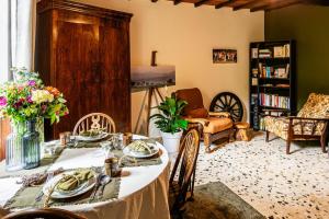 a living room with a table with plates of food at Les Portes Neuves! in Belloc-Saint-Clamens