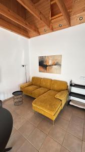 a living room with a brown couch in a room at Ferienhaus Kobel in Stromberg