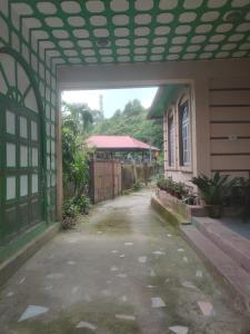 an empty courtyard of a house with a building at Miryok Homes in Mirik