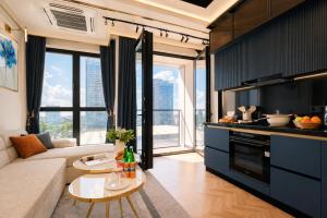 a living room with a couch and a table at NOVA HOME Apartments - NEST ONE, Panoramic Views, Tashkent City in Tashkent