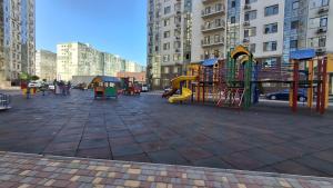 a playground in a city with tall buildings at See4YOU in Odesa