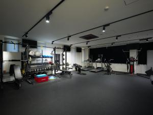 a room with a gym with equipment in it at A village in Fujikawaguchiko