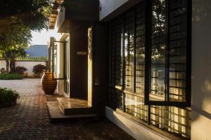 a building with windows on the side of it at Torriam Apartments in Chongwe
