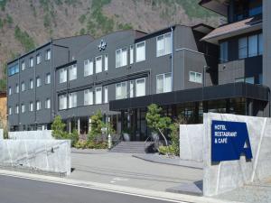 a black building with a sign in front of it at A village in Fujikawaguchiko