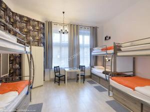 Ένα ή περισσότερα κρεβάτια σε δωμάτιο στο Hostel Lwowska 11