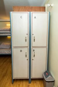 two lockers in a room with a bed at Famous House Kathmandu in Kathmandu