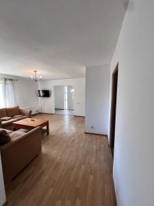 a living room with a couch and a table at Vlădești house in Vlădeşti