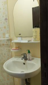 a bathroom with a sink and a mirror at Asrati in Ifrane +4 photos