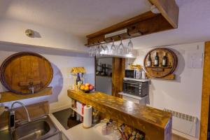 a kitchen with a counter and a sink and a counter top at Kuca za odmor Vinica breg in Varaždin