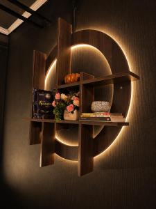 a shelf on the wall with a light on it at Spring Home 2 in Can Tho