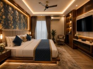 a hotel room with a bed and a television at Hotel The Grand Villa by Signature Stayz Near International Airport in New Delhi