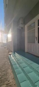 a house with a swimming pool next to a building at Abbronzatissima Capo d'Orlando in Capo dʼOrlando