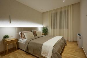 a bedroom with a large bed and a window at Elegant Villa In Vari With Private Pool in Vari +23 photos