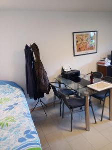 a room with a table and chairs and a bed at Luki's Apartment in Horn-Bad Meinberg