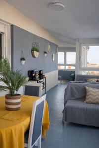 a living room with a table and a couch at Mirador da Guarda in A Guarda