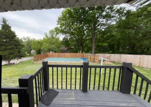 a view of a backyard with a trampoline at Eclectic & Fun Custom Home in Shawnee
