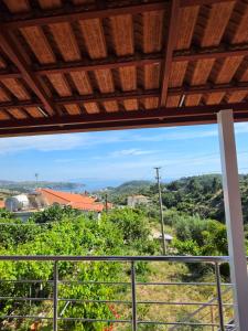 a view of the vineyards from a window at apartment Himara SkyView in Himare