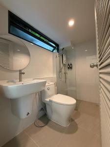 a bathroom with a toilet and a sink and a shower at 2 Bed & 2 Bath Suite, 2nd floor in Ban Bang Toei (1) +24 photos