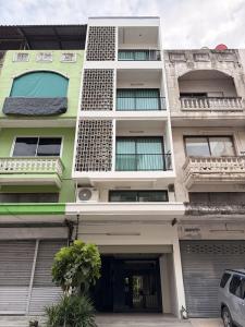 a building with a car parked in front of it at 2 Bed & 2 Bath Suite, 2nd floor in Ban Bang Toei (1)