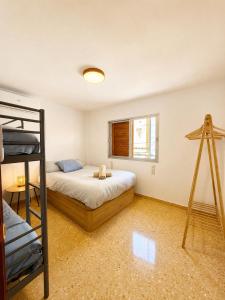 a bedroom with a bunk bed and a ladder at El refugio de NaRo in Chella