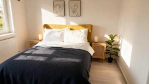 a bedroom with a bed and a potted plant at Modern 2-Bed Apartment in Ramsgate in Ramsgate
