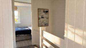 a bedroom with a door leading to a bed at Modern 2-Bed Apartment in Ramsgate in Ramsgate +3 photos
