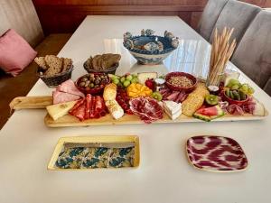 a table with different types of food on it at Yacht Laetitia Delta in Fréjus +14 photos