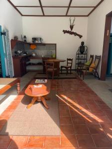 a living room with a table and chairs at Lobo's Retreat in Kurunegala +12 photos