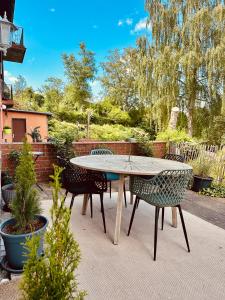 a table and chairs sitting on a patio at Cozy Apartment in Bad Oldesloe