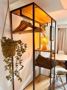 a room with a book shelf with a lamp at Cozy Apartment in Bad Oldesloe