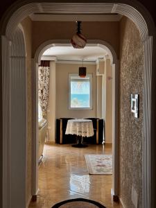 a hallway with a table in the middle of a room at Apartment in Durres Elio in Golem +3 photos