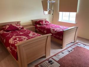 a bedroom with two beds and a window at Jaani 2-1 Apartment in Pärnu