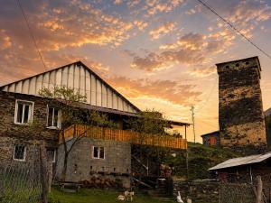 an old building with a silo and a tower at Guest House koshki in Iprari