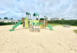 a playground in the sand on a beach at La Dune d’Erdeven in Erdeven