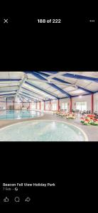 a picture of a swimming pool in a building at Lisa retreat in Preston
