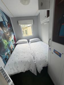 a small bedroom with a bed and a window at Lisa retreat in Preston +9 photos