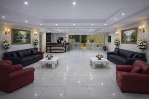 a large living room with couches and tables in it at Sultan Otel Mardin in Sultan Koyu
