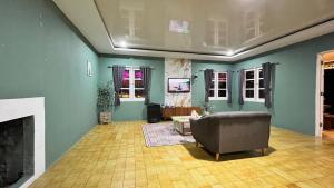 a living room with a couch and a fireplace at Villa Kay View in Sampal 2