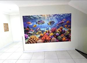 a wall mural of an underwater world with fish at DURBAN BEACHFRONT Tenbury 903 in Durban
