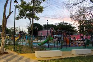 a park with a playground with a slide at Private apartment near the esplanade - KB2 in Campeche