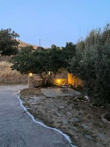 a picnic table sitting in the middle of a yard at Eunoia Syros Suites in Ermoupoli