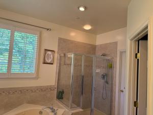 a bathroom with a shower and a sink at LUX homes in Fort Washington +114 photos