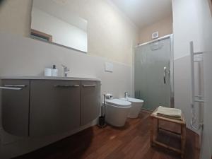 a bathroom with a shower and a toilet and a sink at LaTorrettaLoano Affittacamere in Loano +42 photos