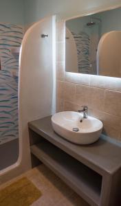 a bathroom with a sink and a mirror at Casa Sabine in Masouri